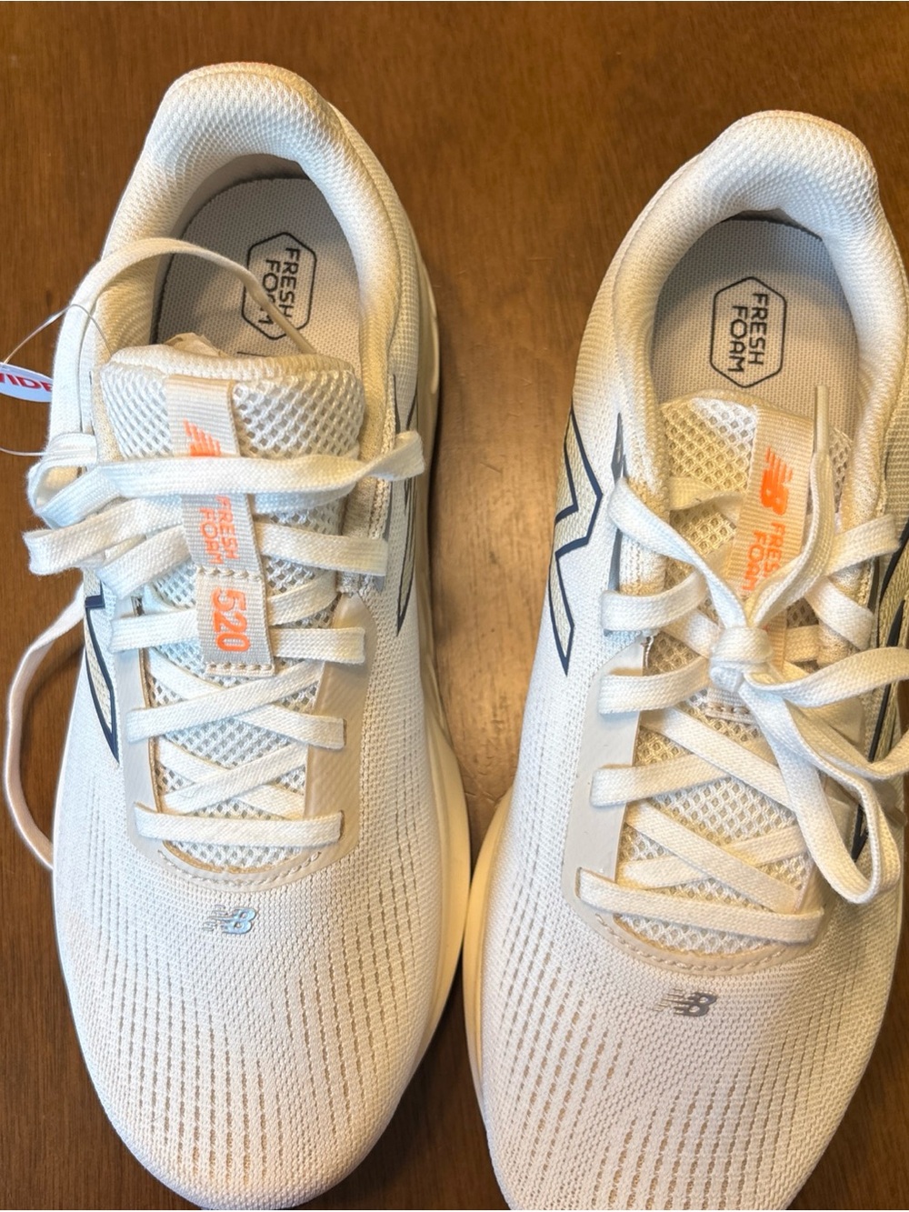 New Balance Women's Athletic Sneakers in White with Navy and Orange Accents
